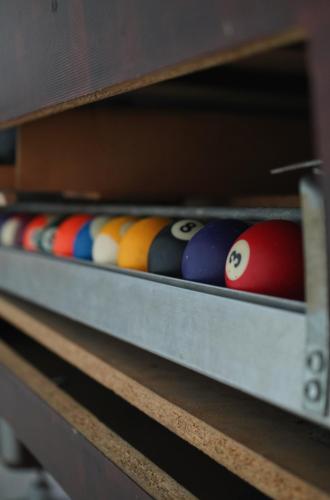 a row of billiard balls in a drawer at Aquasalis in Câmpulung Moldovenesc