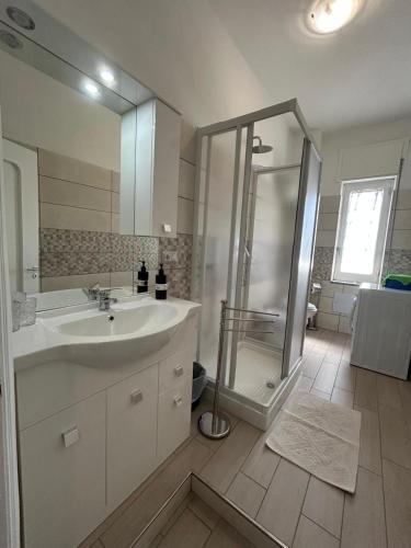 a bathroom with a sink and a shower at Blue House in Santa Maria La Carità