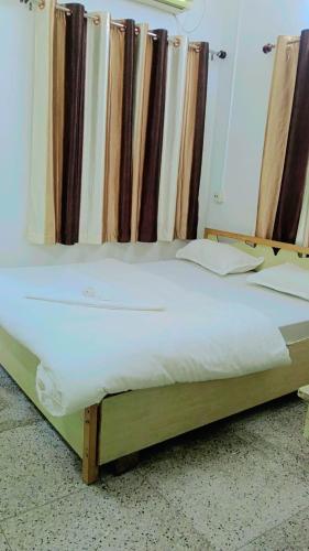 Ένα ή περισσότερα κρεβάτια σε δωμάτιο στο Saltlake Villa