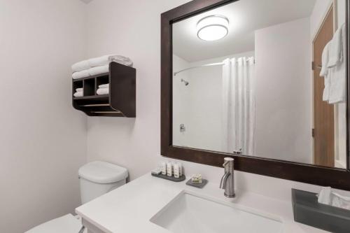 a bathroom with a sink and a mirror at La Quinta by Wyndham Moab in Moab