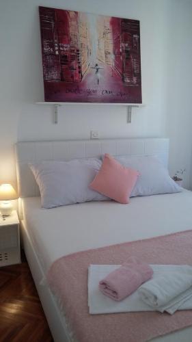 Posteľ alebo postele v izbe v ubytovaní Arco Arina Apartment