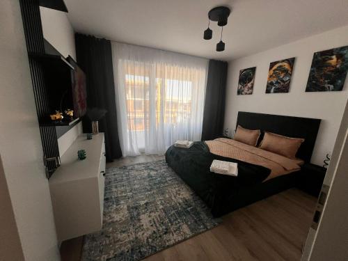 Ένα ή περισσότερα κρεβάτια σε δωμάτιο στο Green Residence Rasnov