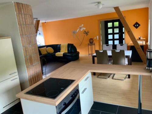 a kitchen and living room with a stove top oven at Ferienhaus Kaltenberger in Laussa