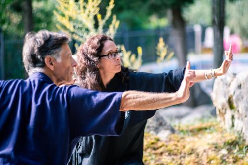 a man and a woman pointing at something at Apanema Mindfulness with Heated Pool, Sauna and Ultra Fast WiFi in Asprogerakata