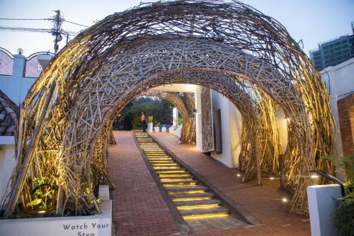 an archway over a brick walkway with stairs at The Nest - Newly Renovated July 2025 in Kigali
