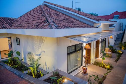 an exterior view of a house with a roof at The Nest - Newly Renovated July 2025 in Kigali