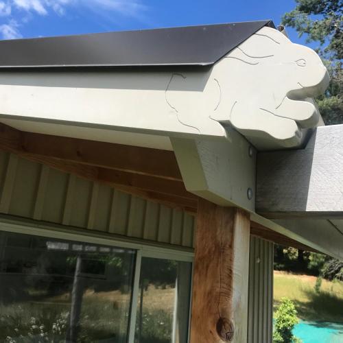 a house with a roof with a cat on it at Mitchella Eco Stay in Wanaka
