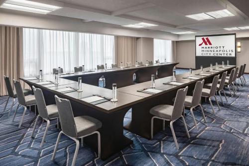 a large conference room with a long table and chairs at Minneapolis Marriott City Center in Minneapolis