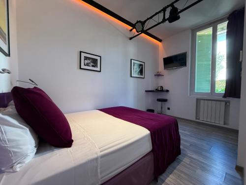 Ένα ή περισσότερα κρεβάτια σε δωμάτιο στο Ideal Sejour Cannes - Hôtel de Charme