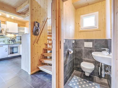 a bathroom with a toilet and a sink at Chalet in Hohentauern by Ski Lift in Hohentauern