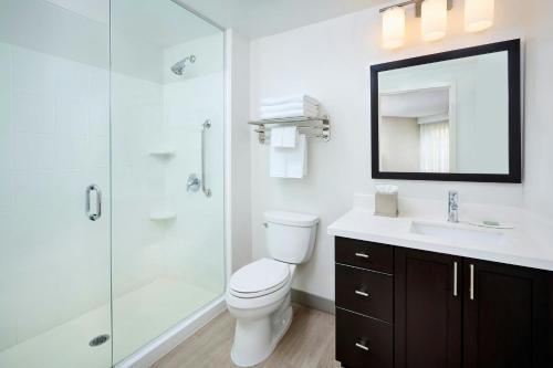 a bathroom with a toilet and a sink and a shower at TownePlace Suites by Marriott Mississauga-Airport Corporate Centre in Mississauga