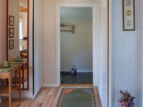 a hallway with a door leading to a dining room at 6 person holiday home in MUNKEDAL in Munkedal