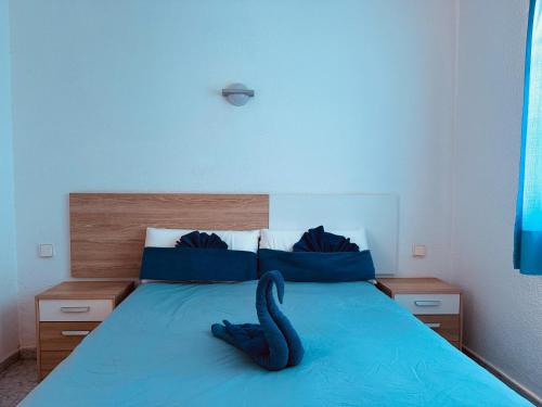 Ένα ή περισσότερα κρεβάτια σε δωμάτιο στο Bungalows Doble UVE