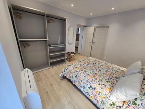 a bedroom with a large bed and a closet at Zia Rina in Bra