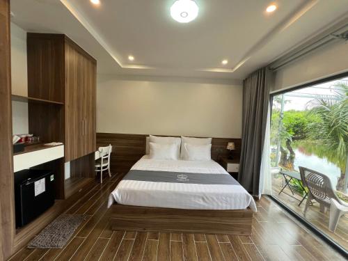 Postel nebo postele na pokoji v ubytování Resort Mộc Hồ