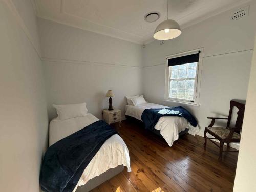 Ένα ή περισσότερα κρεβάτια σε δωμάτιο στο Cottage on Carthage