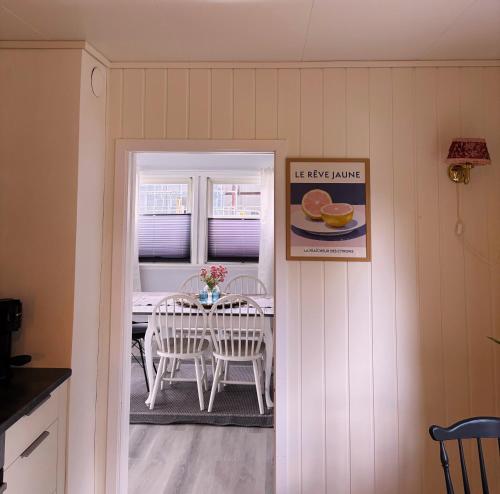 a dining room with a table and chairs in a kitchen at House in Nordfjord, with 4 bedrooms in Nordfjordeid