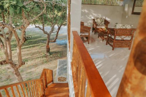 a view from the stairs of a house with a balcony at Quarto Vila HangLoose Por do Sol in Acaraú