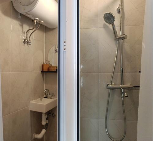 a bathroom with a shower and a sink at Wendy House - Central Sofia - 3BRDR - Private Courtyard - 5 min to Vitosha blvd in Sofia