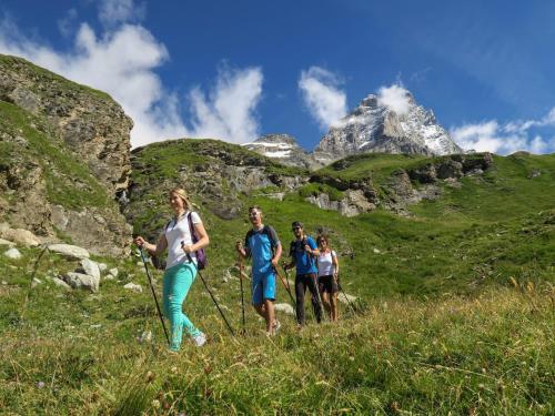 a group of people walking on a mountain trail at Apartment Breuil-Cervinia near Ski Lift in Breuil-Cervinia