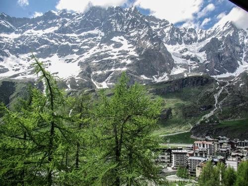 a view of a snow covered mountain with a city at Apartment Breuil-Cervinia near Ski Lift in Breuil-Cervinia
