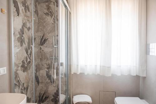 a bathroom with a shower and a toilet at Bed and Breakfast Al Portanova in Reggio Calabria