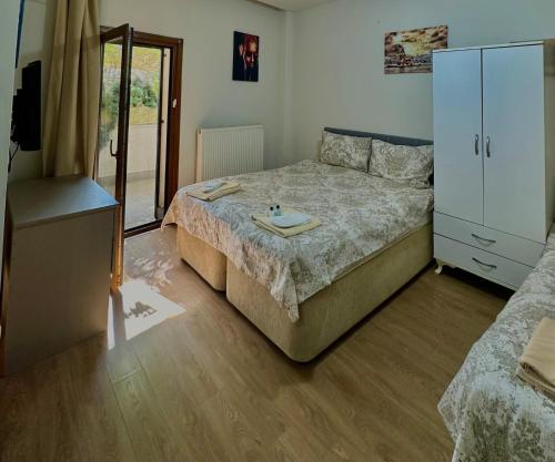 a bedroom with a bed and a dresser in it at Link Taksim Hotel in Istanbul