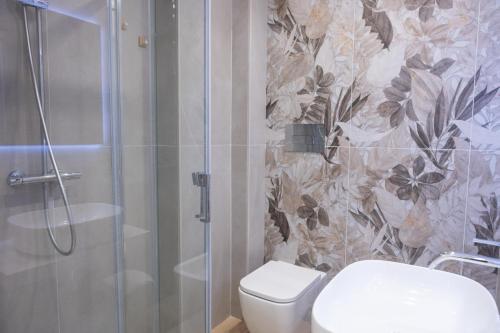 a bathroom with a shower with a toilet and a glass shower at Bed and Breakfast Al Portanova in Reggio Calabria