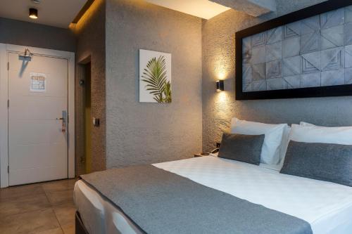 Ένα ή περισσότερα κρεβάτια σε δωμάτιο στο Mielo Lara Hotel