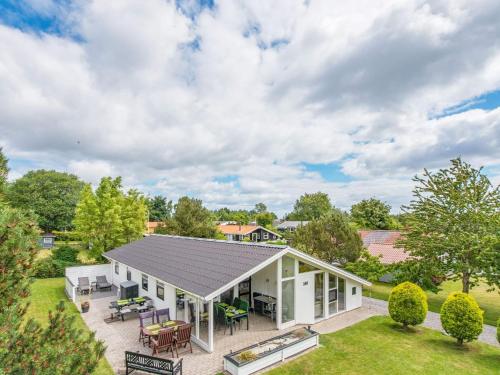 an aerial view of a house with a patio at 4 star holiday home in Juelsminde in Sønderby
