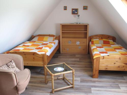 Llit o llits en una habitació de Ferienwohnung Lotz