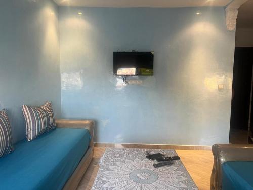 TV a/nebo společenská místnost v ubytování Apartamento familiar cerca del mar, Martil