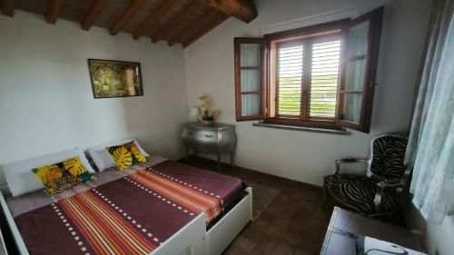 Ένα ή περισσότερα κρεβάτια σε δωμάτιο στο La Quercia