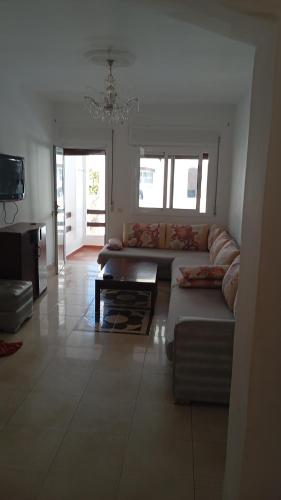 a living room with a couch and a table at B nadir in Tetouan