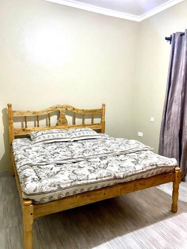 En eller flere senge i et værelse på Cozy Corner Stay in Moshono, Arusha