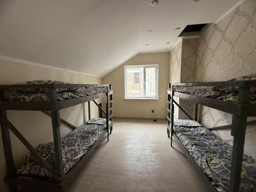 Postel nebo postele na pokoji v ubytování Sun City Hostel