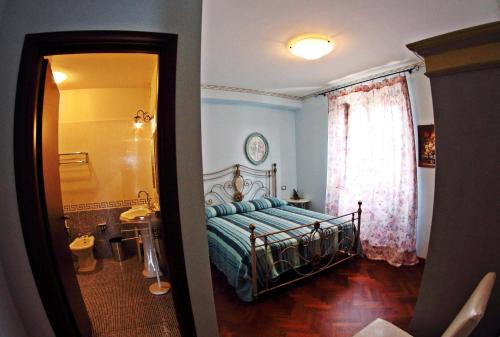 מיטה או מיטות בחדר ב-Appartamento Vacanze Magnolia e Glicine