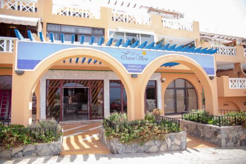 een gebouw met een boog ervoor bij Ocean view OR426 in Adeje