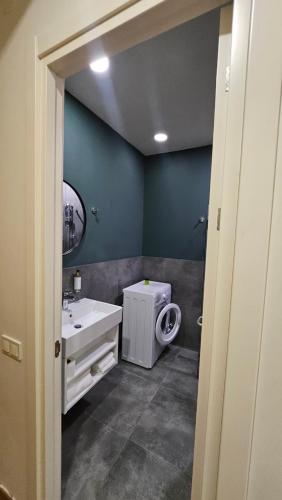 a bathroom with a sink and a toilet in it at Arkhi Kokhta Bakuriani Apt 304 in Bakuriani