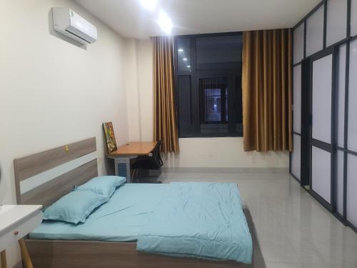Una cama o camas en una habitación de COM NHA homestay