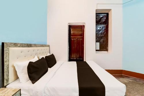 Katil atau katil-katil dalam bilik di Hotel O Mannat