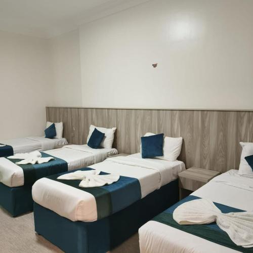 Katil atau katil-katil dalam bilik di Hotel Adil Alzen