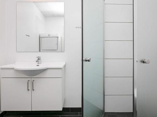 a bathroom with a sink and a shower at 6 person holiday home in Ringkøbing in Ringkøbing