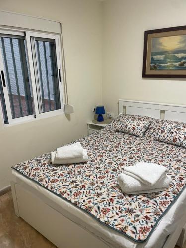 Ένα ή περισσότερα κρεβάτια σε δωμάτιο στο Oliva Seaside Apartments
