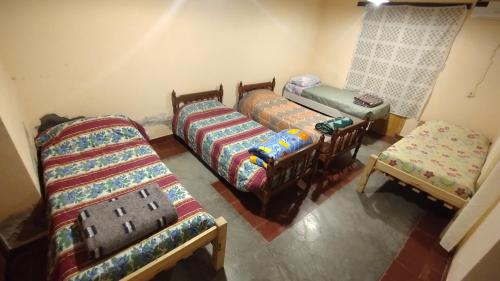 Postel nebo postele na pokoji v ubytování Casa los Molles Hostel