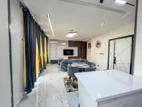 a living room with a couch and a table at CASONEViIIE apartments lekki in Lagos