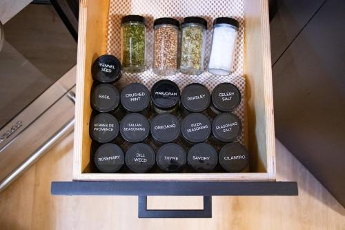 a drawer filled with bottles of herbs and spices at Cozy Chic Alpine Suite with AC - Walk to Lake in Tahoe City