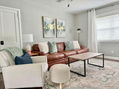a living room with a couch and a coffee table at Restful Retreat with 4 Beds Sleeps 6 in Valdosta