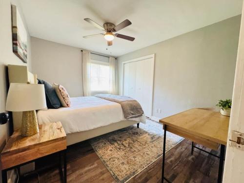 a bedroom with a bed and a ceiling fan at Restful Retreat with 4 Beds Sleeps 6 in Valdosta