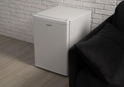 a white refrigerator sitting next to a brick wall at Shakaryan Rancho&Restaurant in Dsegh